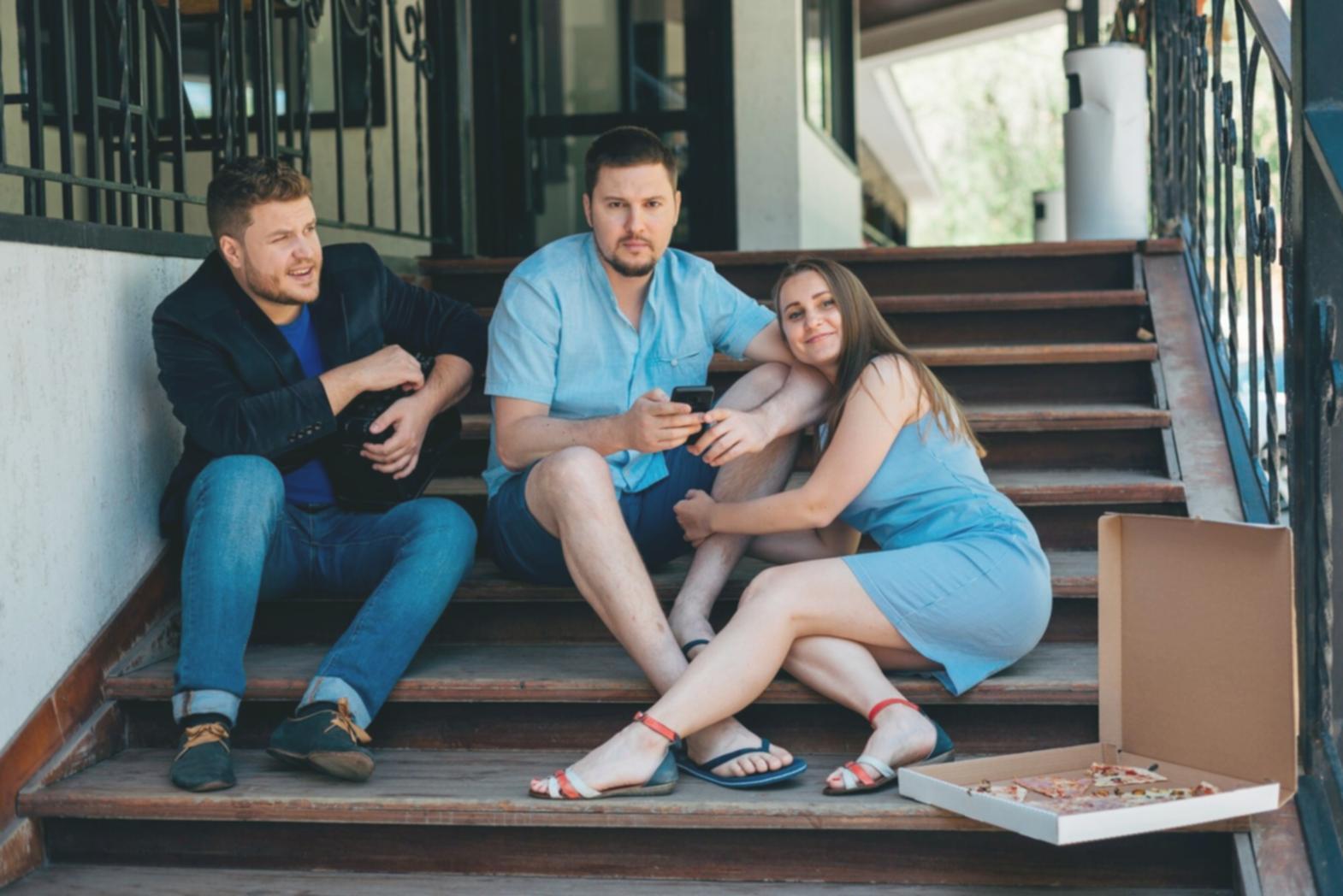 Professional analyzing financial documents and market trends on multiple screens